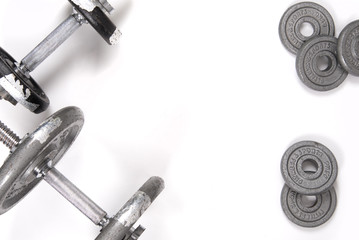 Dumbbell and weights on a white background