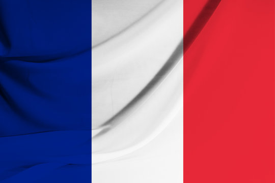 The national flag of France on fabric texture background. Flag image for design on flyers, advertising.