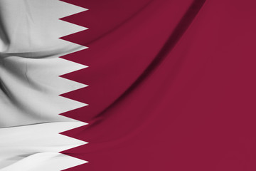 The national flag of Qatar on fabric texture background. Flag image for design on flyers, advertising.