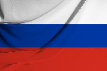Fototapeta premium The national flag of Russia on fabric texture background. Flag image for design on flyers, advertising.