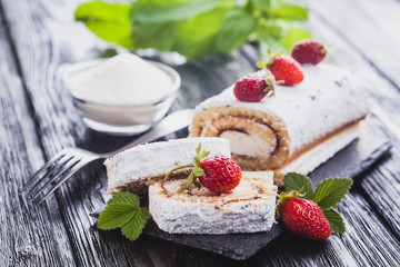 tasty strawberry dessert on a slate board on a black wooden table. Homemade Fresh Baking