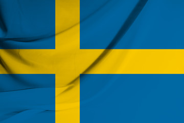The national flag of the Kingdom of Sweden on fabric texture background. Flag image for design on flyers, advertising.