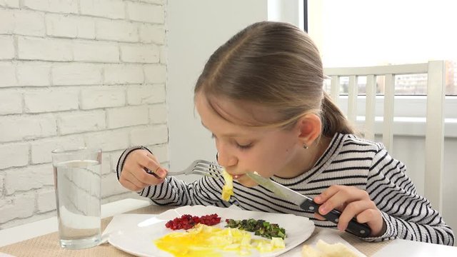 Kid Eating Breakfast in Kitchen, Child Eats Fried Eggs, Teenager Girl Enjoying Vegetables, Greenery Healthy Food