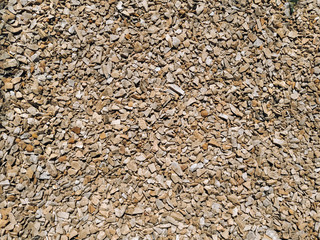 Light beige marble gravel texture, top view.