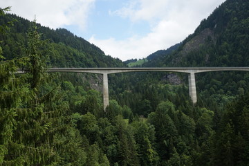 Bridge over the river in the Swiss Alps