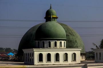 Obraz premium two parallel domes of the mosque and dark green.