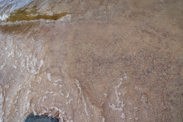 sandy coastal strip with waves