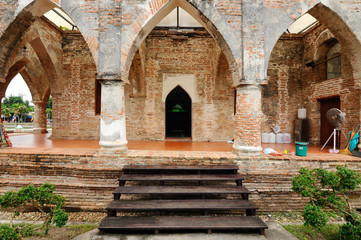 PATTANI, THAILAND -JULY 10, 2014: Historic Kru Se mosque which is made of bricks with round pillars. The mosque represents a unique Islamic civilization of the Kingdom of Pattani in Thailand.