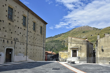 A narrow street among the old houses of Papasidero, a rural village in the Calabria region.