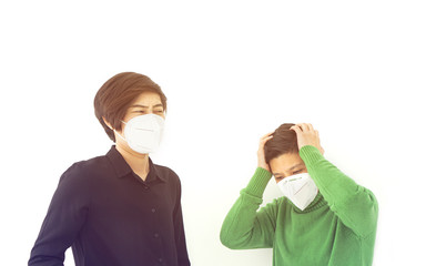 Two Asian diversity friends frustrated angry and worry from corona virus covid-19 wearing mask