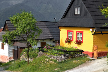Fototapeta na wymiar Vlkolinec, Slovakia: typical colorful cottages in an admired settlement preserved in its original state.