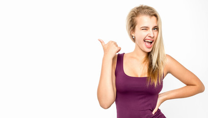 Young female with blond hair posing against white background. Emotions.