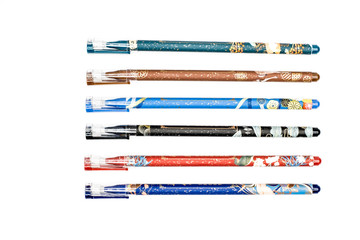 pens in various colors and patterns on a white background