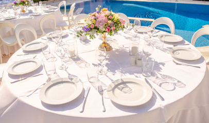 set table with empty dishes and clean glasses