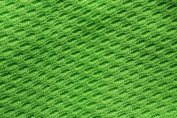 Green sports clothing fabric football shirt jersey texture close up