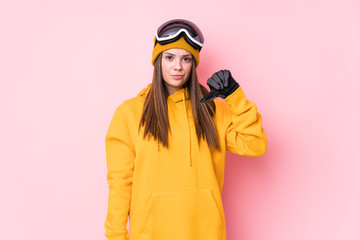 Young caucasian skier woman isolated showing a dislike gesture, thumbs down. Disagreement concept.