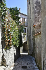 A narrow street among the old houses of Aieta, a rural village in the Calabria region.