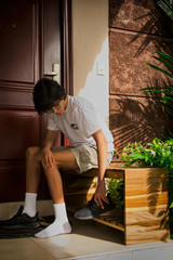 young man sitting on a bench