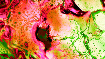 Abstract background of colored liquid, top shot, close-up.