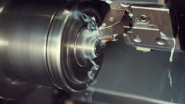 cnc machine. industry. CNC Lathe Machinemakes Metal Detail on Factory.  milling operation with liquid cooling. cnc. 