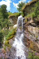 Fototapeta na wymiar Kleiner Wasserfall in Vals in der Schweiz 31.7.2020