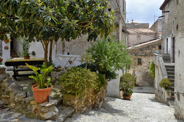 A narrow street among the old houses of Scalea, a rural village in the Calabria region, Italy.