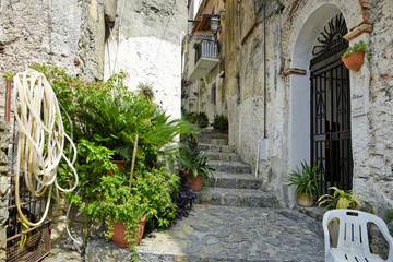 Fototapeta na wymiar A narrow street among the old houses of Scalea, a rural village in the Calabria region, Italy.