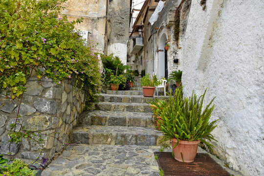 A narrow street among the old houses of Scalea, a rural village in the Calabria region, Italy.