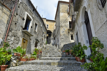 Fototapeta na wymiar A narrow street among the old houses of Scalea, a rural village in the Calabria region, Italy.