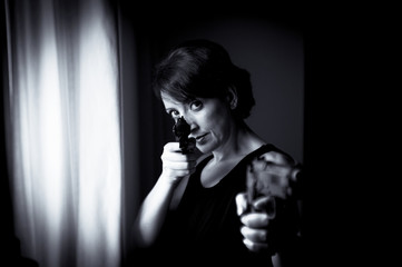 Portrait of woman with gun