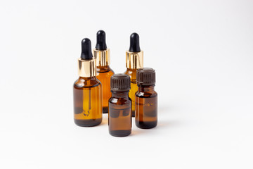 A set of amber bottles for essential oils and cosmetics. Glass bottle. Dropper, spray bottle