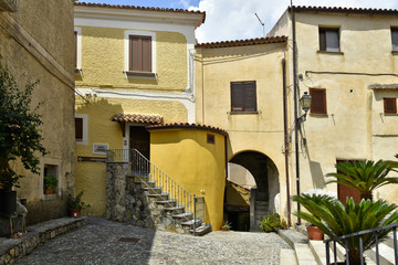 A narrow street among the old houses of Scalea, a rural village in the Calabria region, Italy.