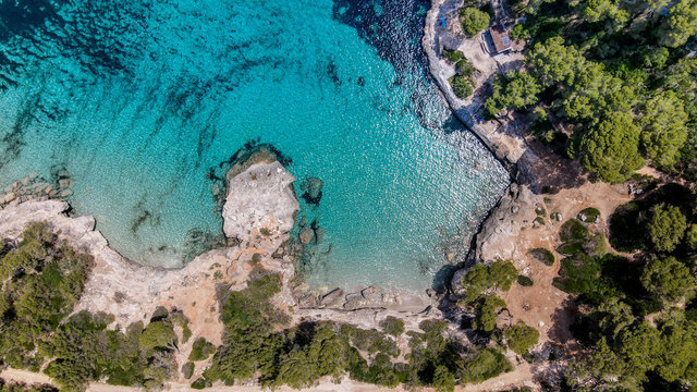 Beautiful aerial view of Mediterranean white sand beach and turquoise water in Menorca Spain, Cala Mitjana, aerial top view drone photo © Ada