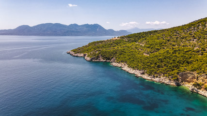 Fototapeta premium Aerial view of beautiful coastline in Mediterranean coast of Spain, Costa Brava. Panorama of Rocks on the coast in beautiful summer day. Beautiful beach with turquoise sea, boats, holiday destination 
