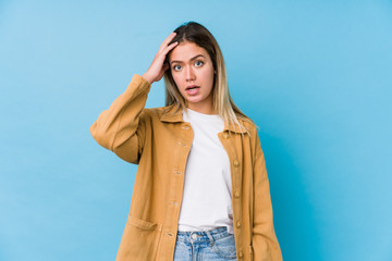 Young caucasian woman being shocked, she has remembered important meeting.