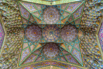 Iran,  this beautiful decorated ceiling is inside the Mosque Nasir-ol-Molk in the city Shiraz