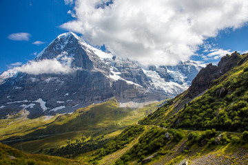 Fototapeta premium The Eiger trail and The Eiger, a 3,967-metre (13,015 ft) mountain of the Bernese Alps, overlooking Grindelwald and Lauterbrunnen in the Bernese Oberland of Switzerland