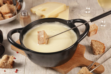 cheese fondue with bread and wine