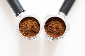 Portafilters filled with ground coffee