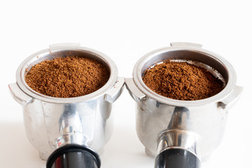 Portafilters filled with ground coffee