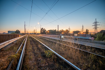 Fototapeta na wymiar Old tram tracks at dusk in the countryside.