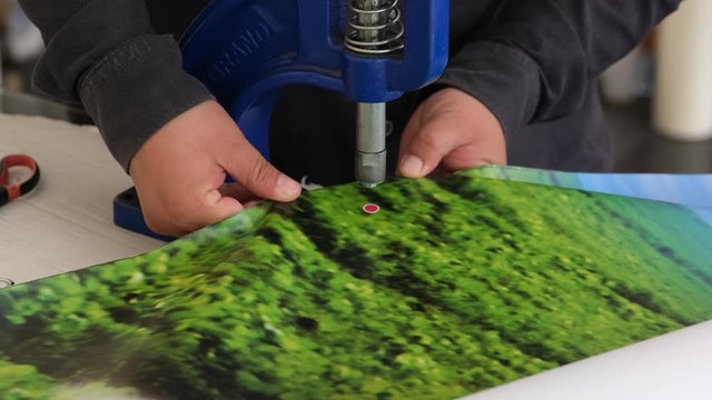 People using eyelet machine