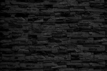 Black brick building wall. Interior of a modern loft. Background for design