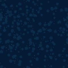 Seamless abstract pattern with dark blue background and spots.