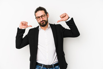 Young caucasian business man isolated on a white background feels proud and self confident, example to follow.
