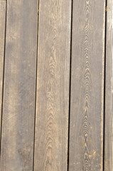 The background is made of grey wooden planks, vertical. 1