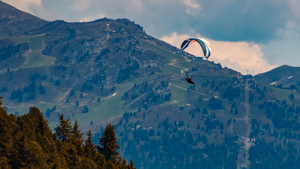 Beautiful alpine view with a paraglider at the famous Zillertaler Hoehenstrasse, Tyrol, Austria