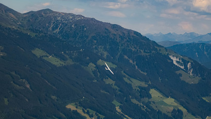 Beautiful alpine view with a glider at the famous Zillertaler Hoehenstrasse, Tyrol, Austria