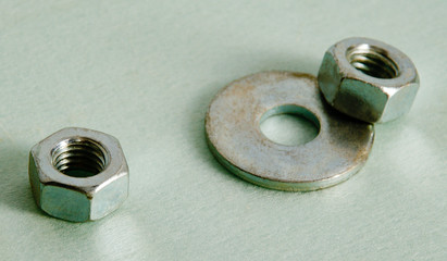 Obraz premium Nuts and puck lie on a white background.