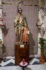 NAZARETH, ISRAEL, January 26, 2020: The figure of St. Joseph with Jesus in the Church of St. Joseph...